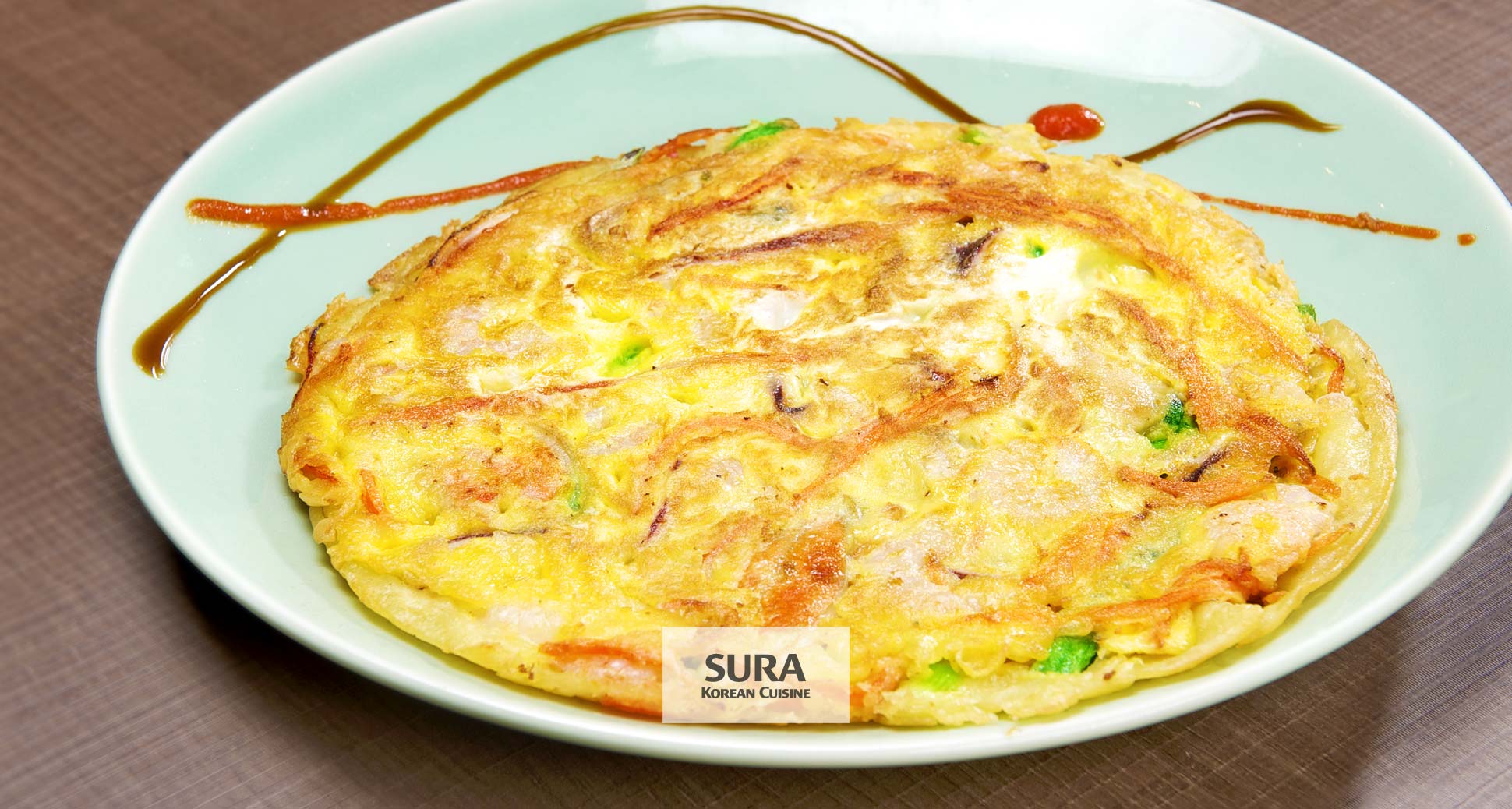 Why do koreans love to enjoy korean style pancakes and drink korean rice wine on a rainy day?
